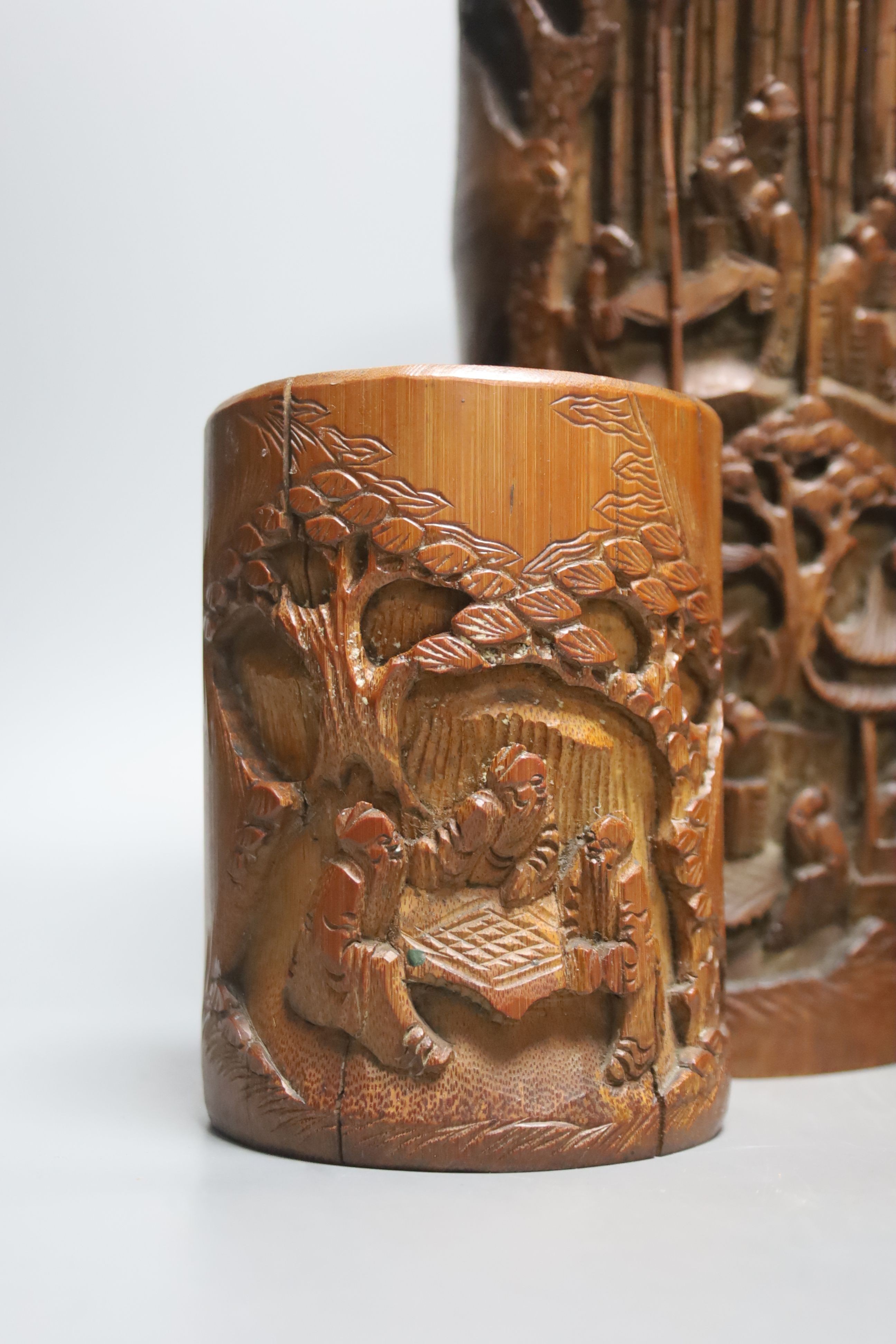 Four Chinese bamboo brushpots and a caddy, tallest brush pot 29 cms high.